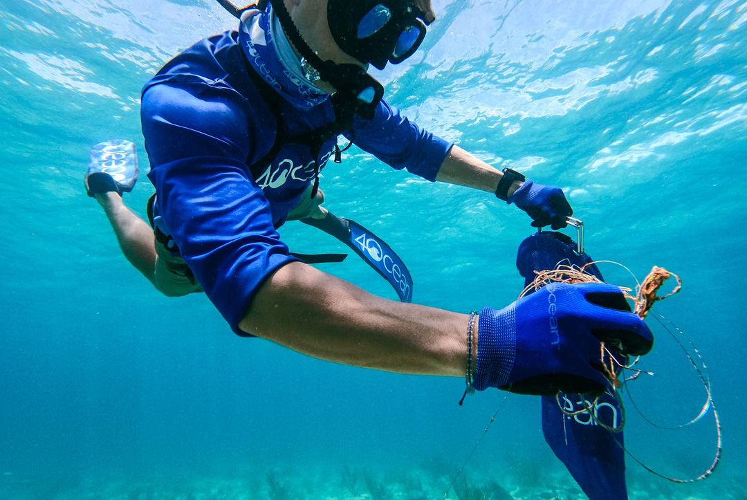 A diver using a BLU3 dive system during an underwater cleanup